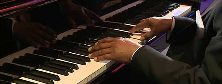 Image of a piano being played
