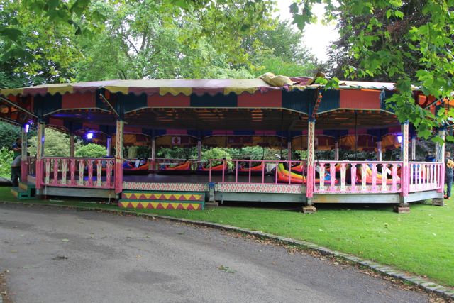 Image of a set of dodgems on a croquet lawn.