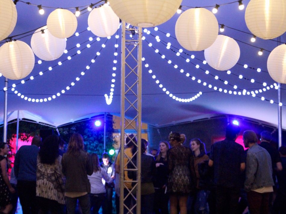 Image of a stretch marquee with white and coloured lighting.