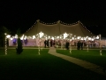 Image of a marquee with a STYLISH exterior canopy with fairy-lights and festoon.